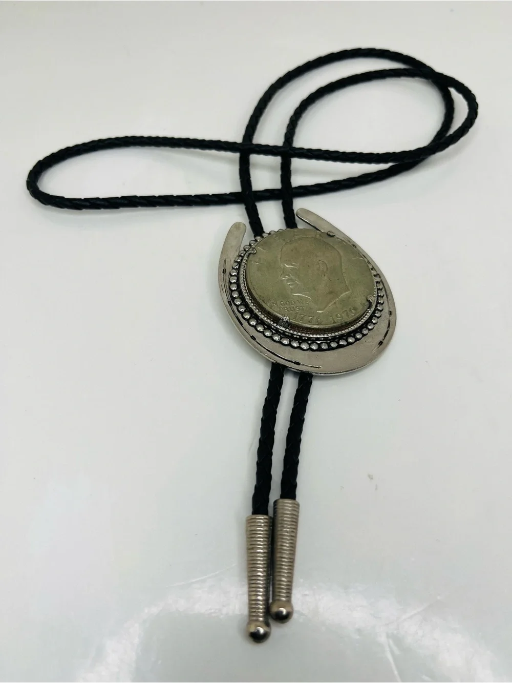 Black Braided Leather Bolo Tie with Silver Horseshoe and Coin Medallion